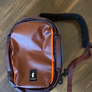 Cotopaxi Brown and Orange Messenger Bag with Modern Design
